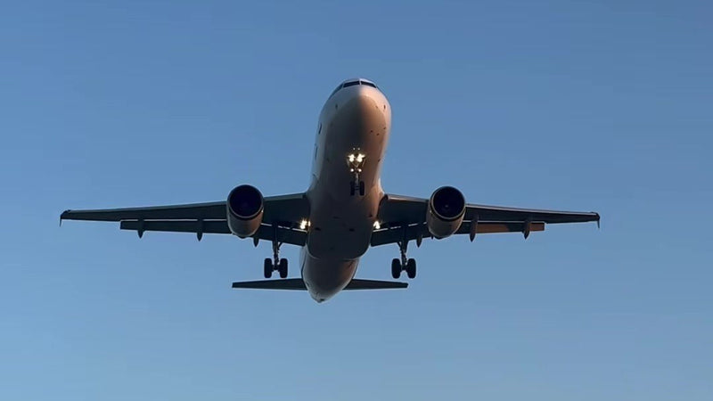 Passenger plane coming in to land at Zante airport against a clear blue sky, the start of a summer season abroad for UK workers