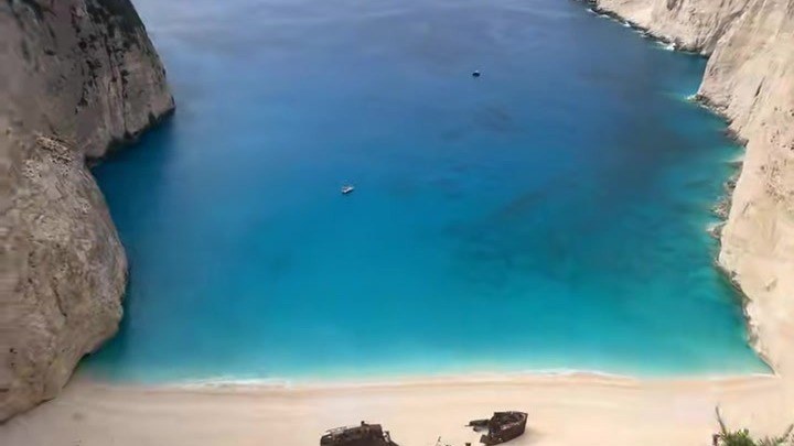 Navagio (Shipwreck) Beach in Zante seen from the clifftop viewpoint, with turquoise water below white cliffs